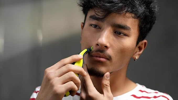 Philips OneBlade Hybrid Body and Face Stubble Trimmer with 4 x Lengths, 2 Extra Blade and Travel Pouch,