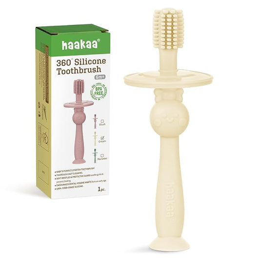 haakaa 360° Baby Toothbrush with Suction Base - Gentle Cleaning for Infant Self-Brushing Training, Food-Grade Silicone, Adjustable Safety Shield - Cream (1 Piece)